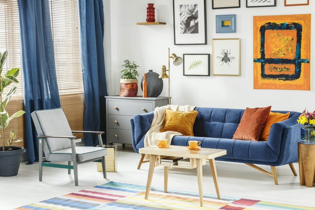bright-and-cozy-living-room-interior-with-blue-drapes-a-sofa-wi.jpg