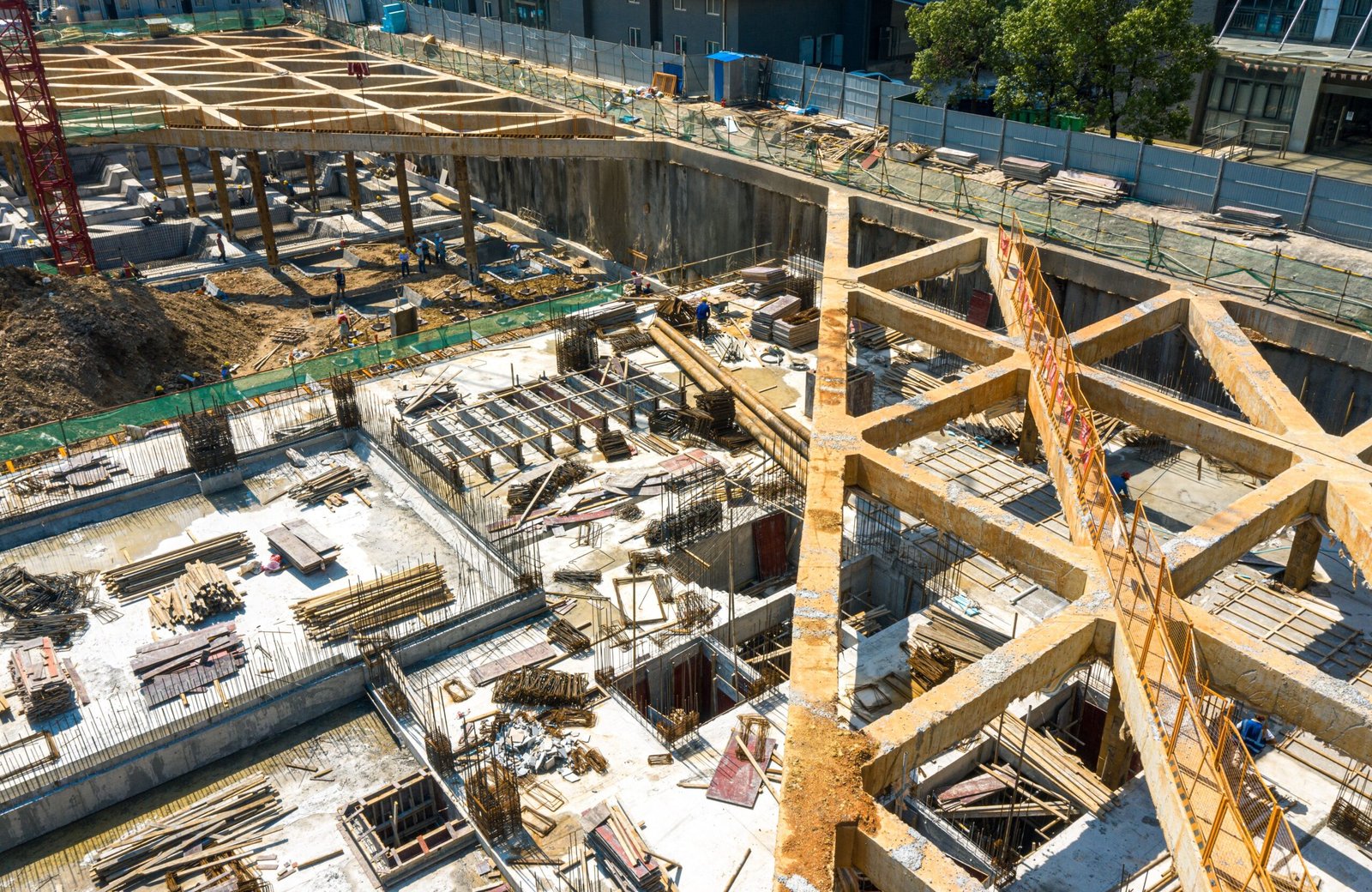 An aerial shot of the construction site in the summer morning.
