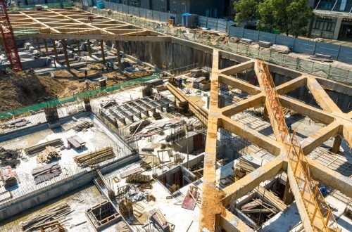 An aerial shot of the construction site in the summer morning.